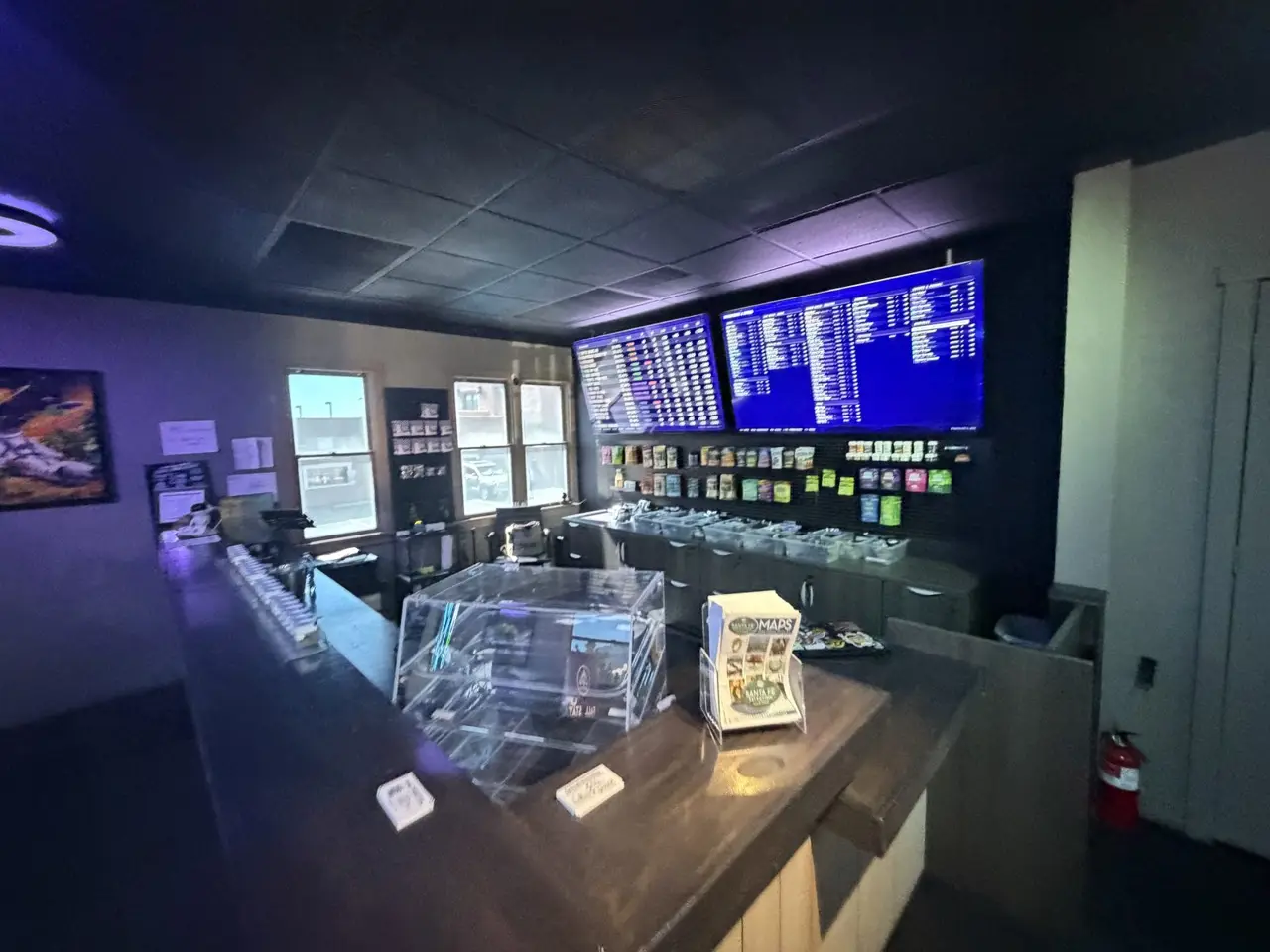 The counter at Deep Sky Downtown with the menu screens behind it
