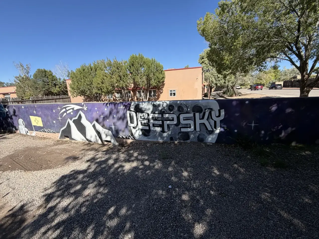 The purple Deep Sky mural, with mountains, a comet and the moon
